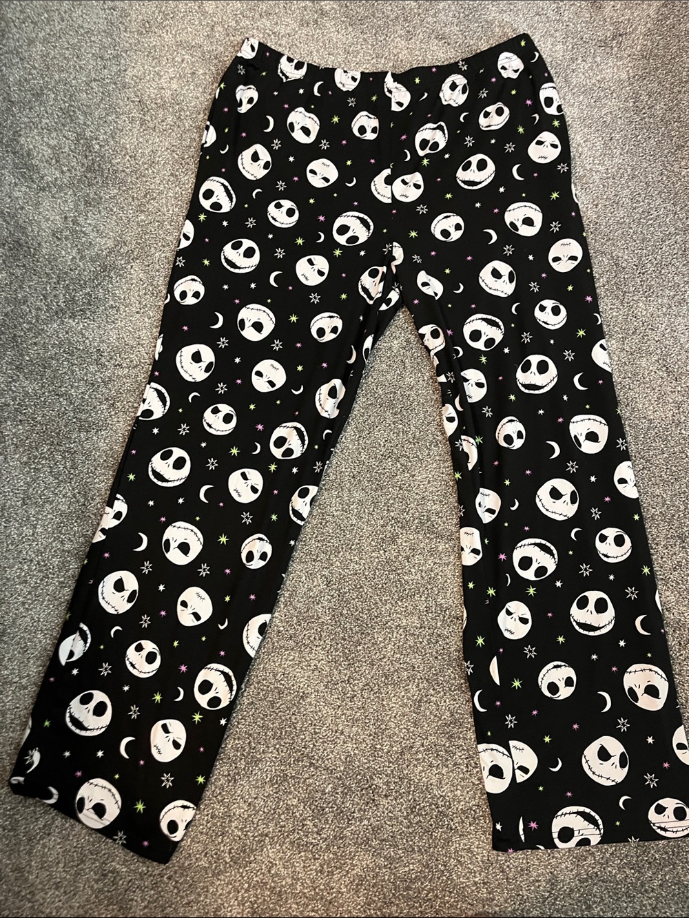 Disney Black Pajama Pants with White Skull Faces and Colorful Star Accents